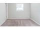Bright bedroom featuring neutral walls and plush carpeting at 4412 Rustic Wood Dr, Stone Mountain, GA 30083