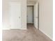 Bright bedroom with neutral walls and carpet flooring, and two closets at 4412 Rustic Wood Dr, Stone Mountain, GA 30083