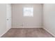 Spacious bedroom with neutral walls and carpet flooring at 4412 Rustic Wood Dr, Stone Mountain, GA 30083