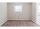 Well-lit bedroom with neutral walls and carpet flooring at 4412 Rustic Wood Dr, Stone Mountain, GA 30083