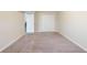 Simple bedroom with carpet and access to another room at 4412 Rustic Wood Dr, Stone Mountain, GA 30083