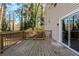 Deck with wooded backdrop and access from sliding glass door at 4412 Rustic Wood Dr, Stone Mountain, GA 30083