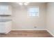 Simple dining room with hardwood floors and a window at 4412 Rustic Wood Dr, Stone Mountain, GA 30083