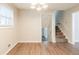 Dining room with hardwood floors and a view of the staircase at 4412 Rustic Wood Dr, Stone Mountain, GA 30083
