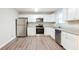 Modern kitchen with stainless steel appliances and granite countertops at 4412 Rustic Wood Dr, Stone Mountain, GA 30083