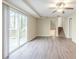 Living room with hardwood floors, ceiling fan and stairs at 4412 Rustic Wood Dr, Stone Mountain, GA 30083