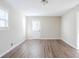Living room with wood-look flooring and exterior access at 4412 Rustic Wood Dr, Stone Mountain, GA 30083