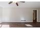 Living room with hardwood floors and an open doorway to hallway at 4412 Rustic Wood Dr, Stone Mountain, GA 30083