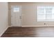 Living room featuring hardwood floors and a white door at 4412 Rustic Wood Dr, Stone Mountain, GA 30083