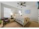 Cozy bedroom with neutral decor, ceiling fan, and ample closet space at 5964 Wolf Creek Dr, Atlanta, GA 30349