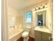 Bathroom highlighting a combined tub and shower and gray vanity at 3945 Peninsula Ct, Lawrenceville, GA 30044