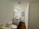 Bright bathroom featuring double vanity, wood flooring, and ample space at 3945 Peninsula Ct, Lawrenceville, GA 30044