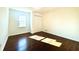 Bright bedroom featuring hardwood floors, closet, and natural light at 3945 Peninsula Ct, Lawrenceville, GA 30044