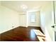 Inviting bedroom featuring hardwood floors, closet, and natural light at 3945 Peninsula Ct, Lawrenceville, GA 30044