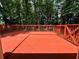 View of a spacious deck overlooking a lush, wooded backyard, perfect for outdoor entertaining and relaxation at 3945 Peninsula Ct, Lawrenceville, GA 30044