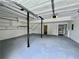Spacious garage with ample storage, shelving, and updated lighting for convenience at 3945 Peninsula Ct, Lawrenceville, GA 30044