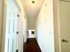 Inviting hallway featuring hardwood flooring and a view of a fireplace at 3945 Peninsula Ct, Lawrenceville, GA 30044