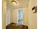 Hallway showcasing access to various rooms, including one with a walk-in closet at 3945 Peninsula Ct, Lawrenceville, GA 30044