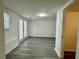 Open-concept living space featuring stylish flooring and direct access to the outdoors at 3945 Peninsula Ct, Lawrenceville, GA 30044