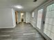 Bright living room with modern floors and patio doors, leading to outdoor relaxation at 3945 Peninsula Ct, Lawrenceville, GA 30044