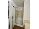 Bathroom featuring a glass-enclosed shower at 3945 Peninsula Ct, Lawrenceville, GA 30044
