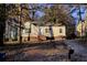 Ranch style home with a tree-lined yard and driveway at 1743 Marcel Sw Ave, Atlanta, GA 30311