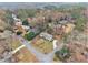 An aerial shot shows the layout of homes in a wooded neighborhood with mature trees and manicured lawns at 2418 Brookdale Ne Dr, Atlanta, GA 30345