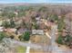 Aerial view of a home nestled among mature trees, showing the surrounding neighborhood at 2418 Brookdale Ne Dr, Atlanta, GA 30345