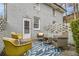 Cozy back patio with outdoor seating, a decorative rug, and a brick wall providing privacy at 2418 Brookdale Ne Dr, Atlanta, GA 30345