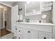 Bright bathroom with white vanity, marble countertop, and shower at 2418 Brookdale Ne Dr, Atlanta, GA 30345