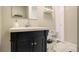 Bathroom featuring a vanity with a dark cabinet and a white sink, complemented by a mirrored wall cabinet at 2418 Brookdale Ne Dr, Atlanta, GA 30345