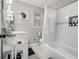 Bright bathroom features a shower and tub combination, toilet, and vanity at 2418 Brookdale Ne Dr, Atlanta, GA 30345
