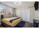 Bright bedroom with a large window, hardwood floors, and closet space at 2418 Brookdale Ne Dr, Atlanta, GA 30345