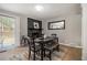 Bright dining area with a modern gray brick fireplace and seamless flow to the outdoor space and kitchen at 2418 Brookdale Ne Dr, Atlanta, GA 30345