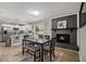 Cozy dining area with a modern fireplace, seamlessly connected to a well-equipped kitchen and breakfast bar at 2418 Brookdale Ne Dr, Atlanta, GA 30345