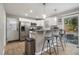 Modern kitchen with stainless steel appliances, granite countertops, and a breakfast bar with seating for casual dining at 2418 Brookdale Ne Dr, Atlanta, GA 30345