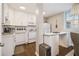 Well-lit kitchen with white cabinetry, stainless steel appliances, and a breakfast bar area at 2418 Brookdale Ne Dr, Atlanta, GA 30345