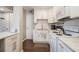 Charming kitchen features modern appliances, white cabinets, and hardwood floors at 2418 Brookdale Ne Dr, Atlanta, GA 30345