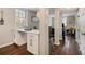 Bright kitchenette area with breakfast bar, stainless steel appliances, and hardwood flooring at 2418 Brookdale Ne Dr, Atlanta, GA 30345