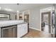 Open-concept kitchen and living room area features wood flooring and neutral color palette at 2418 Brookdale Ne Dr, Atlanta, GA 30345