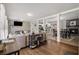 Bright, open concept living space features hardwood floors, a brick fireplace, and seamless flow to the dining area at 2418 Brookdale Ne Dr, Atlanta, GA 30345