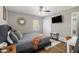 Comfortable main bedroom features a neutral color palette, hardwood floors, and natural lighting at 2418 Brookdale Ne Dr, Atlanta, GA 30345