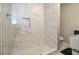 Large walk-in shower with marble tile and glass enclosure at 2418 Brookdale Ne Dr, Atlanta, GA 30345