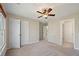 Bright bedroom with ceiling fan and ample closet space at 6315 Sturbridge Ln, Cumming, GA 30040