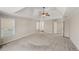 Large main bedroom with a tray ceiling, carpet, and windows at 6315 Sturbridge Ln, Cumming, GA 30040