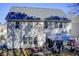View of the back exterior featuring a covered patio with stylish furniture and a well-maintained lawn at 3258 Kessock Ridge Trl, Snellville, GA 30039
