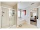 Bathroom with glass shower, soaking tub, and open view to main bedroom suite at 3258 Kessock Ridge Trl, Snellville, GA 30039