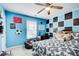 Bedroom featuring custom blue-and-black wall design at 3258 Kessock Ridge Trl, Snellville, GA 30039