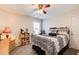 Cozy bedroom featuring a ceiling fan and carpeted floors at 3258 Kessock Ridge Trl, Snellville, GA 30039