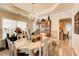 Elegant dining room with a decorative chandelier, wainscoting details, and plenty of space for entertaining at 3258 Kessock Ridge Trl, Snellville, GA 30039